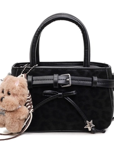 Retro leopard print crossbody bag with black handles and metal star charm on white background
