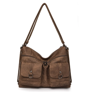 Detailed front view of brown vintage leather tote with two large pockets and metal rings