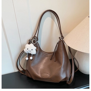 Detailed macro of dark coffee leather texture with Fashion & Bags embossed logo