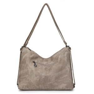 Detail view of khaki canvas hobo bag with front zipper pocket and adjustable strap