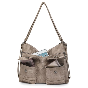 Detail view of khaki retro tote bag with dual front pockets and iPad storage capacity