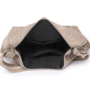Detail view showing large interior capacity with canvas texture and secure zippers