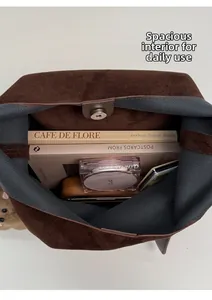 Deep brown faux suede tote bag featuring a spacious interior with magnetic snap closure