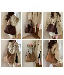 Detail view of large tote bag in dark brown and khaki with plush bear charm