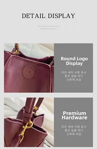 Close-up of burgundy grain leather bucket bag with gold hardware and embossed logo