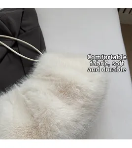 Detail shot of the white plush faux fur texture with soft durable fabric and shoulder strap