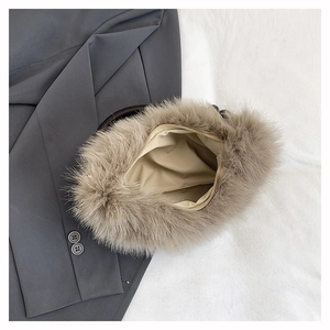 Detailed interior of fluffy faux fur handbag featuring fabric lining and zipper closure