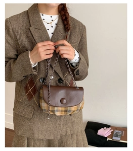 Retro plaid saddle bag with brown leather flap and stylish silver chain shoulder strap
