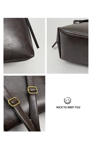 Detailed macro view of vintage dark brown leather backpack with brass buckles and stitching