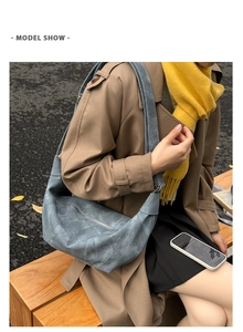 Chic morandi blue dumpling shoulder bag with retro leather texture shown on model