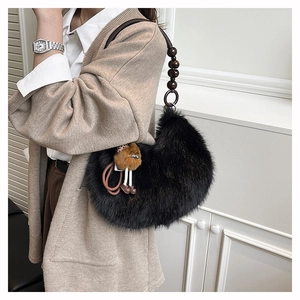 Black faux fur crescent shoulder bag with wooden bead strap and cute plush pendant charm