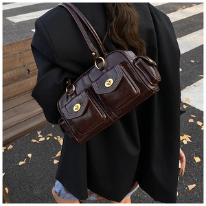 Deep brown retro underarm bag with dual pockets and white stitching in street style