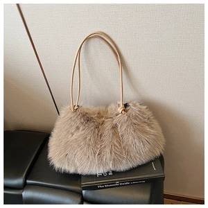Detailed macro view of the fluffy brown faux fur texture and beige leather straps