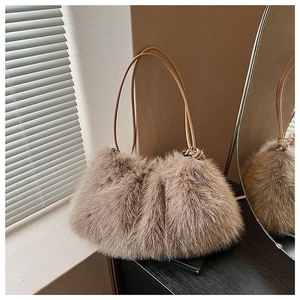 Macro detail of plush faux fur texture and leather straps on brown stylish tote bag