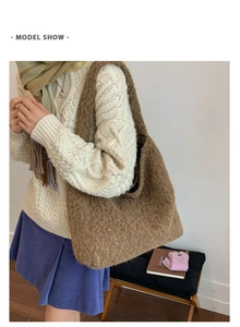 Detailed close-up of brown plush fuzzy tote bag with soft texture and large capacity