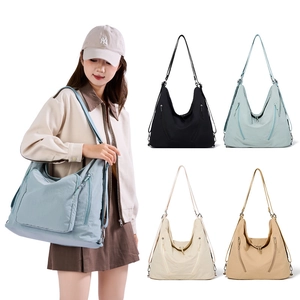 Detail of multi-color nylon hobo bags showing side zipper pocket and large capacity design