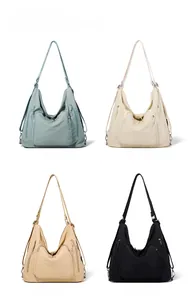 Multi-compartment tote bag in blue, beige, khaki and black water-resistant fabric