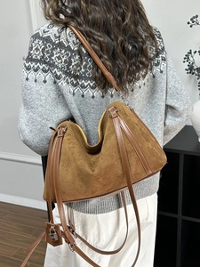 Brown suede tote bag for women featuring silver hardware and versatile crossbody strap