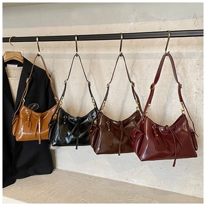 Showcase of vintage faux suede hobo bags in brown, black, coffee, and burgundy colors