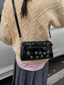 Black punk crossbody bag with silver rivet studs and glossy patent leather finish