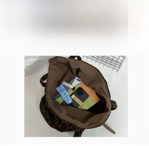 Interior view of leopard print suede tote bag showing large capacity for daily essentials