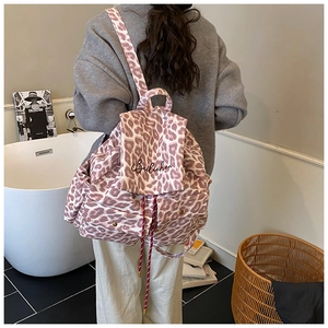 Pink leopard canvas backpack detail with drawstring closure and embroidery