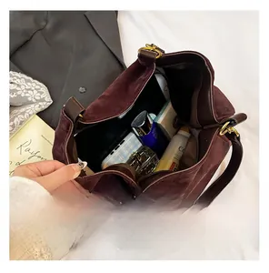 Internal view of a large brown suede tote bag showing its spacious storage capacity