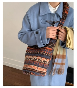 Detail of bohemian striped faux shearling tote bag with ethnic geometric pattern and wide strap