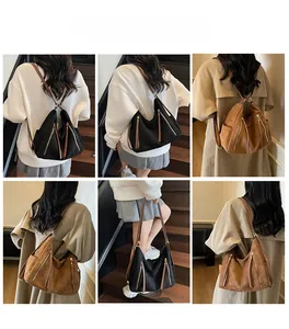 Detail view of multi-pocket retro frosted tote bag shown in black and brown colors