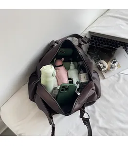Interior view of large brown pebble leather tote bag showing spacious storage capacity