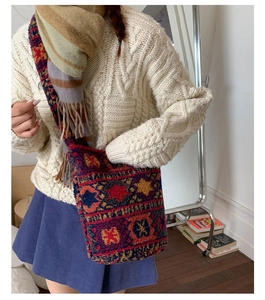 Detail of bohemian fuzzy crossbody bag with geometric patterns on faux lamb wool