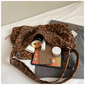 Detail view of large leopard print tote bag interior showing spacious capacity and zipper