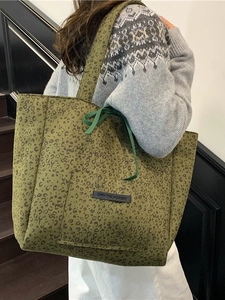 Army green leopard print suede tote bag with front pocket and drawstring closure