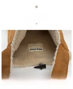 Macro detail of brown suede tote with soft faux shearling lining and toggle button