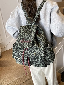 Leopard print canvas backpack in dark green with drawstring and Bailey embroidery