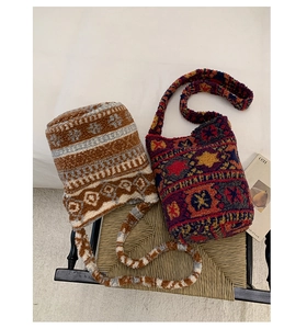 Detail of plush bucket bags featuring vintage ethnic patterns and wide woven shoulder straps