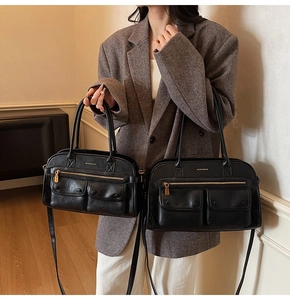 Size comparison of retro black leather tote bags with front pockets and gold logo detail