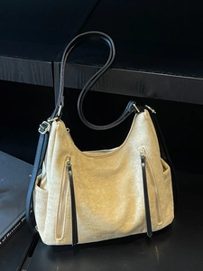 Retro oversized beige suede hobo bag with black leather straps and gold metal zippers