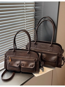 Vintage dark brown multi-pocket leather handbag set with two sizes and soft lighting