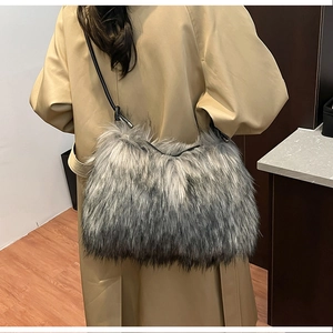 Close-up of stylish grey faux fur crossbody bag with natural gradient texture