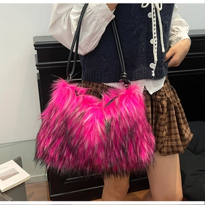 Detail of fluffy faux fox fur tote bag with pink and black gradient texture for women