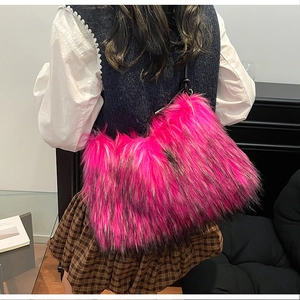 Fashionable bright pink faux fur tote bag with long fluffy hair texture and black strap