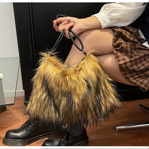 Detailed view of luxury faux fur handbag with fluffy texture and round black top handles