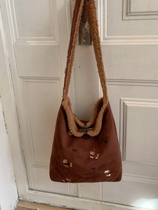 Brown corduroy tote bag with puppy embroidery, faux shearling trim and toggle closure