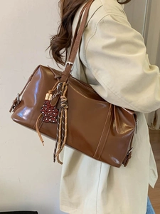Vintage brown PU leather shoulder bag with leopard charm and stylish woven strap detail