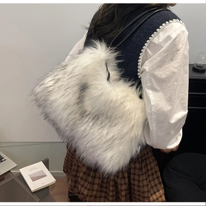 Fashionable faux fur shoulder bag with grey gradient plush texture and slim leather strap