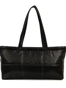 Large black quilted tote bag with padded down-like texture for women commuting