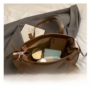 Top view of brown retro tote bag interior showing large capacity for daily essentials