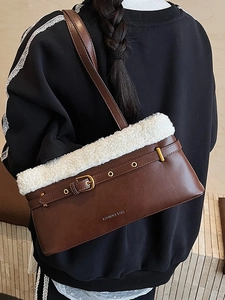 Brown leather shoulder bag with white faux fur trim and gold buckle details for women