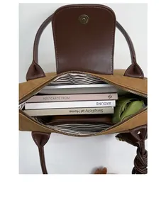 Top view of large capacity tote bag with striped lining showing interior storage space
